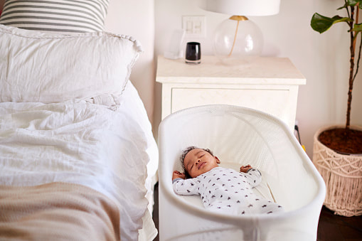 Older baby sleeping in bassinet next to parents bed | Sleep Consultant Adelaide  | Kelly Harper