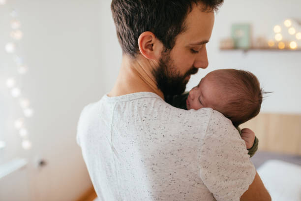 Dad helping baby to go to sleep with movement and sound |Elemental Beginnings | Gentle Sleep Consultant Adelaide